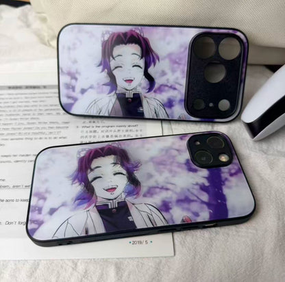Two phone cases with an anime character design on a surface.