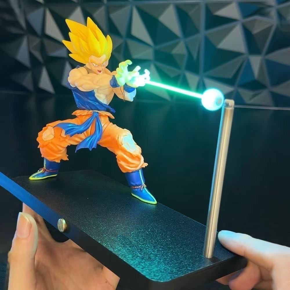 Action figure with glowing energy weapon held by a hand against a geometric patterned background