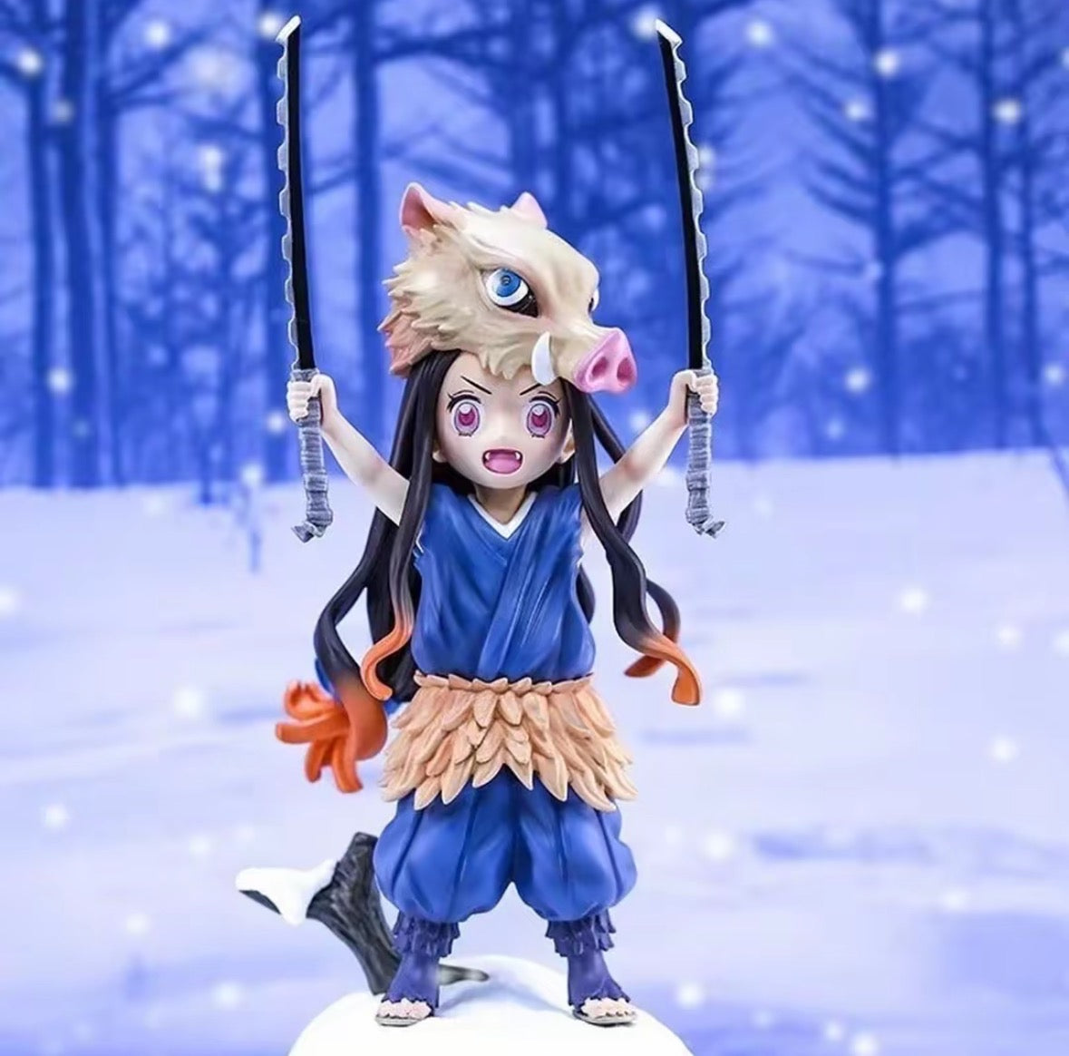 Figurine of a character with long hair and blue outfit in a snowy forest setting