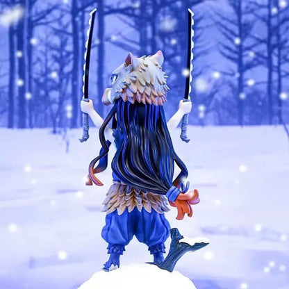 Figurine with blue hair and white headband standing in a snowy landscape with trees.