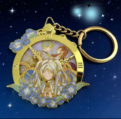 Decorative keychain with angel design on a starry night background